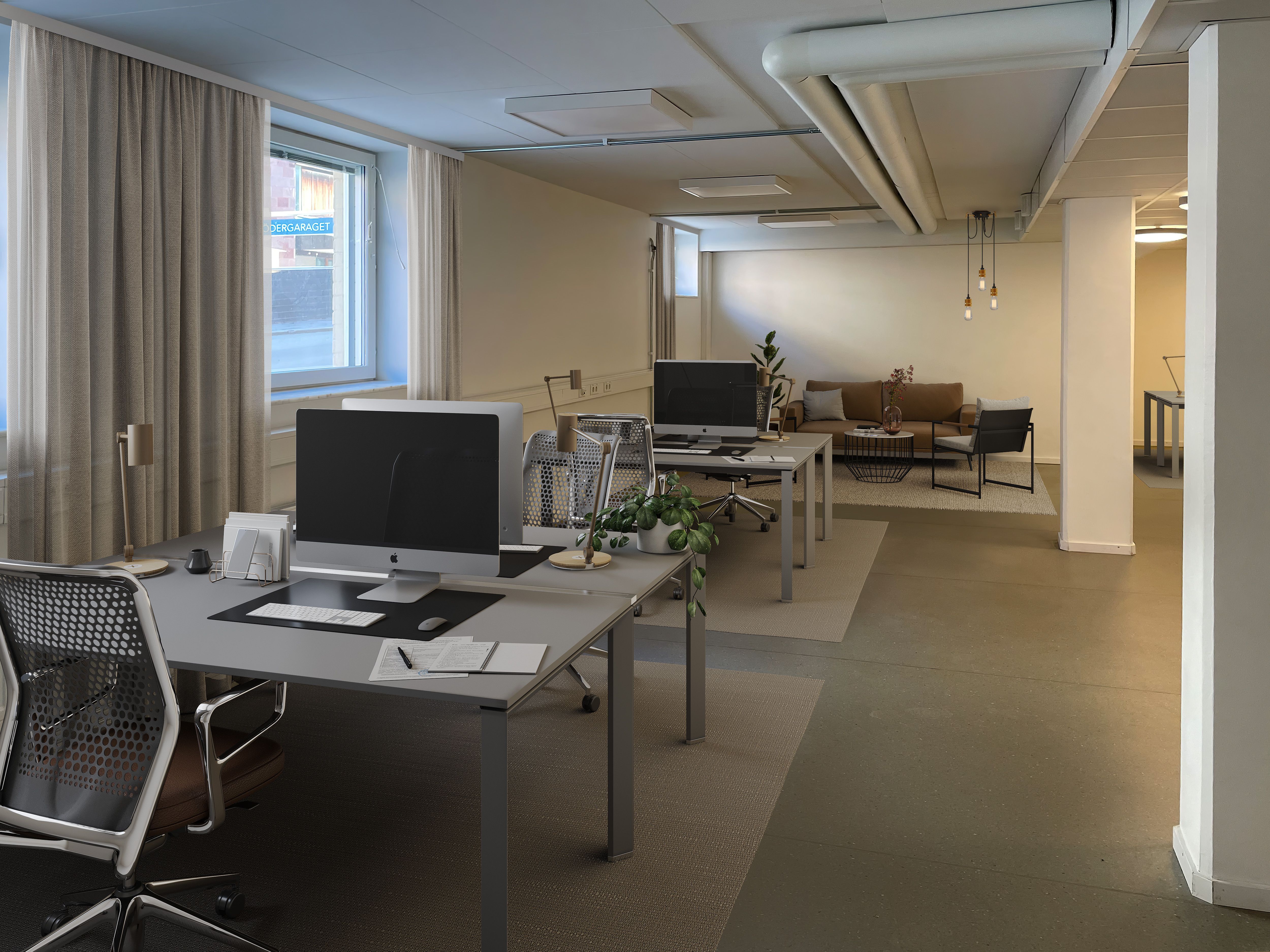 Visionsskiss, öppet kontorslandskap med plats för fyra skrivbord och loungedel.